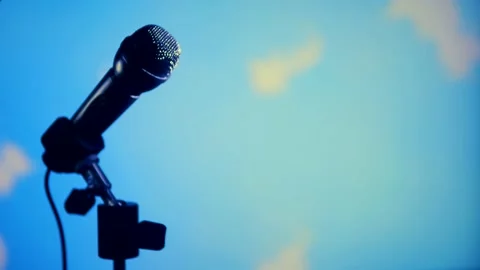 Image of a microphone on a colored background. Stock Footage 131005499