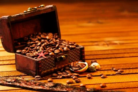 Image of middle-aged coffee beans. Poured into a pirate chest. Precious, expe Stock Photos