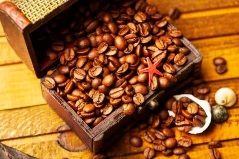 Image of middle-aged coffee beans. Poured into a pirate chest. Precious, expe Stock Photos