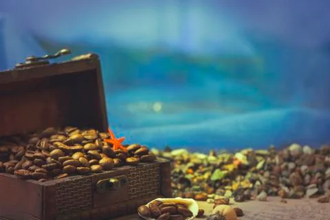 Image of middle-aged coffee beans. Poured into a pirate chest. Precious, expe Stock Photos