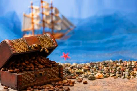 Image of middle-aged coffee beans. Poured into a pirate chest. Precious, expe Stock Photos