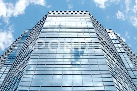 Image of modern office building against cloudy sky Stock Photos