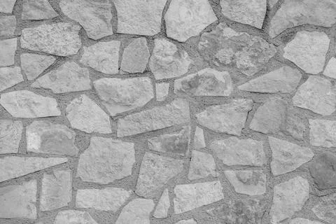 Image of mortared stone wall in rural environment Stock Photos