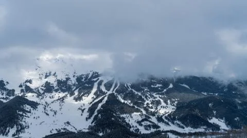 Image of a mountain covered with a snow cloud. Stock Photos