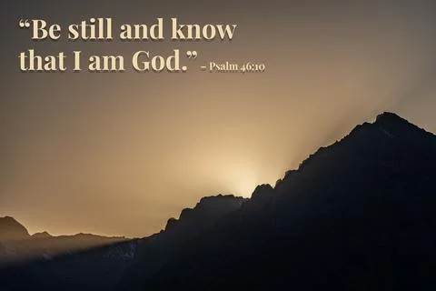 The image is a mountain range with a sunset in the background Stock Photos