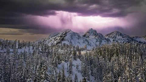 An image of Mt Baker in the North Cascade Mountains covered in snow with li.. Photos