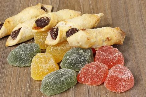 An image of multi-colored marmalade and filled cookies. Stock Photos