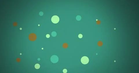 Image of multi coloured dots moving over green background Stock Photos