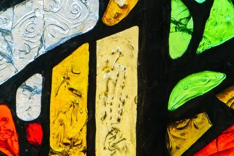 Image of a multicolored stained glass window with irregular block pattern Stock Photos