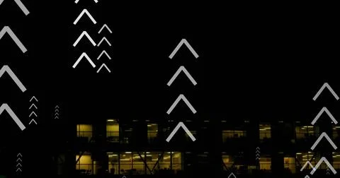 Image of multiple up arrows over aerial view of illuminated modern building Stockfoto's