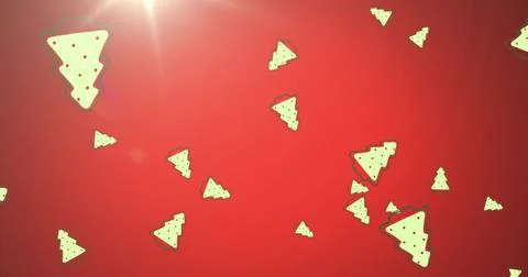 Image of multiple christmas trees falling with glowing light on red background Illustrazione stock