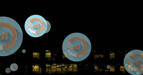 Image of multiple graph icons over aerial view of modern building against night Fotos de archivo