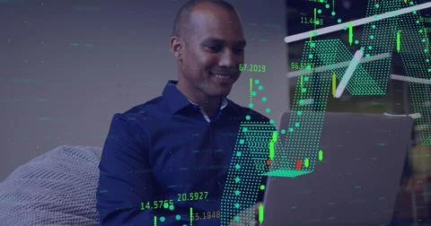 Image of multiple graphs with changing numbers over biracial man working on Stock Photos