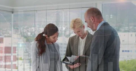 Image of multiple graphs with numbers over caucasian coworkers looking at diary Stock Photos