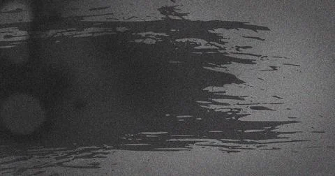 Image of multiple grey smudges and spots moving on seamless loop Foto stock