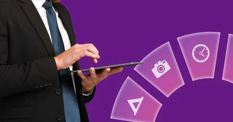 Image of multiple icons over midsection of businessman scrolling on digital Stock Photos