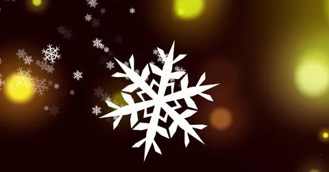 Image of multiple snowflakes icons falling over yellow spots of light against Illustrazione stock