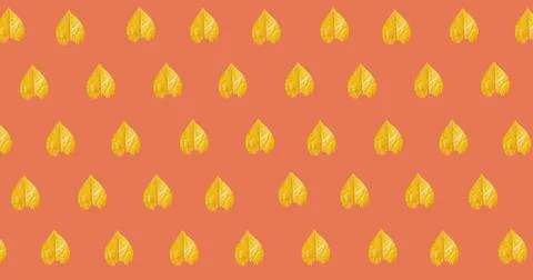 Image of multiple yellow autumn leaves over orange background Ilustração Stock