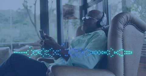 Image of music data processing over african american man with headphones Stock Photos