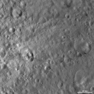 This image from NASA s Dawn spacecraft of asteroid Vesta shows Teia crater... Stock Photos