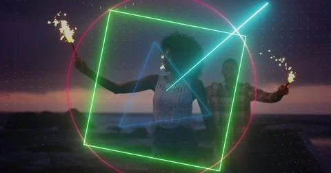 Image of neon scanner processing data over couple celebrating with sparklers on Fotos Stock
