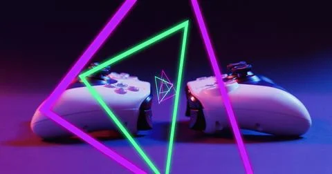 Image of neon triangles over image game computer pads Stock Photos