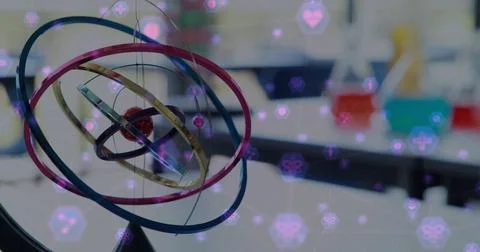 Image of network of connection with interface icons over model of atom moving in Stock Photos