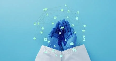 Image of network of connections with icons over hands holding blue ribbon o.. Stock Photos