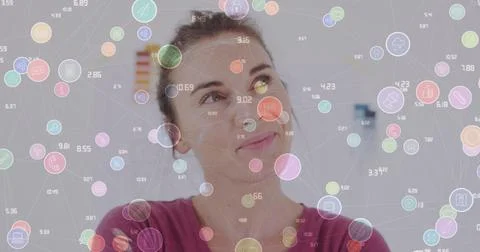 Image of network of connections with icons over caucasian woman smiling at Stock Photos