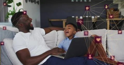 Image of network of connections over happy african american father and son using Stock Illustration