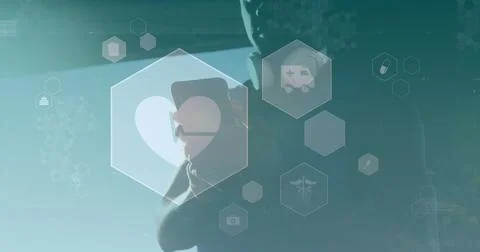 Image of network of digital icons over african american man using smartphone in Foto stock