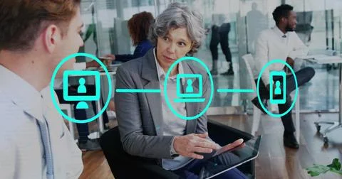Image of network of icons over diverse businessman and businesswoman discussing Stock Photos