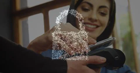Image of network security padlock over people using payment terminal Foto stock