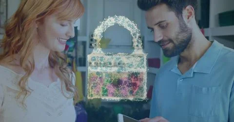 Image of network security padlock over people using payment terminal Foto stock
