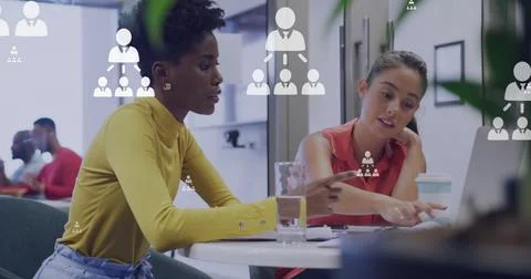 Image of networking icons and data processing over diverse business people Stock Photos
