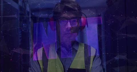 Image of nft text over asian male worker in server room 스톡 사진