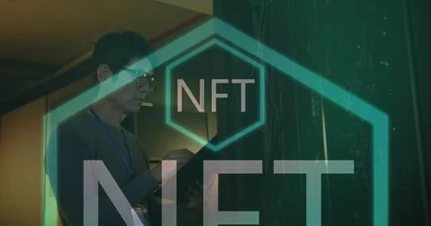 Image of nft text over asian male worker in server room Stock Photos