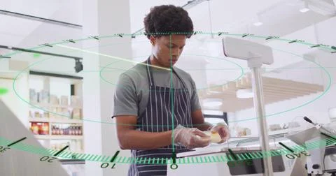 Image of numbers and data processing over biracial man serving food in shop Foto stock