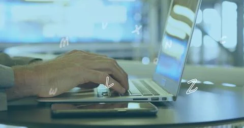 Image of numbers and letters moving over man typing on laptop Stock-Fotos