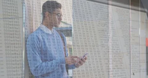 Image of numbers changing and data processing on computer screens over man using Stockfoto's