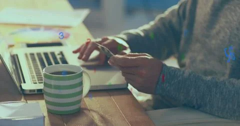 Image of numbers changing and processing over man using laptop computer Foto stock