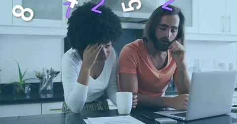 Image of numbers changing over diverse couple using laptop Fotos Stock