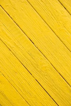 Image of old diagonal boards with bright yellow paint Stock Photos