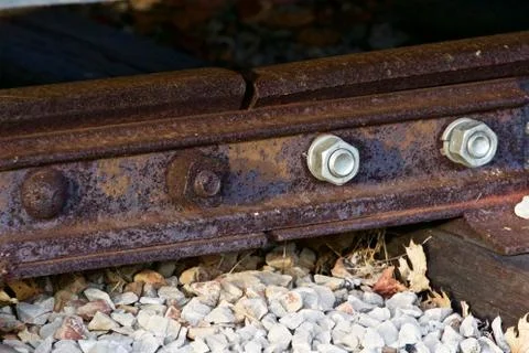 Image with the old rusty and new nuts of the railroad Stock Photos