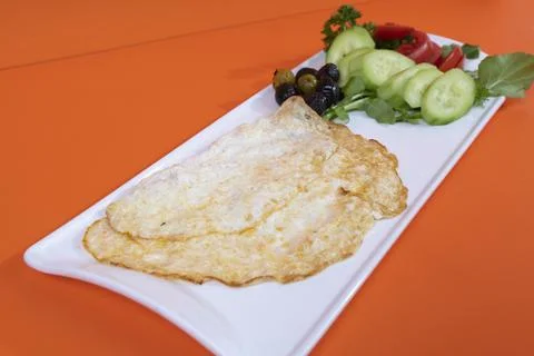 Image of Omelet with Milk on Orange Background Foto stock