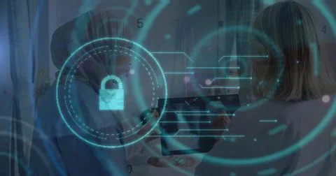 Image of online security padlock and scope over diverse female doctors Stockfoto's