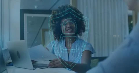 Image of online security padlock, lights over biracial businesswoman in offic Stockfoto's