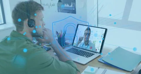 Image of online security padlock over caucasian man using phone headset and Foto stock