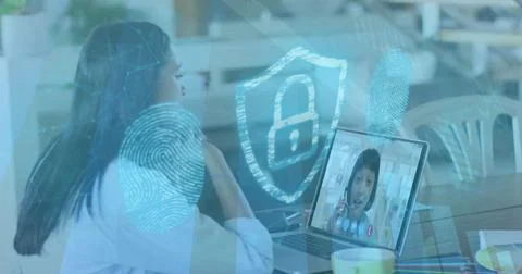 Image of online security padlock over biracial businesswoman on laptop image Stockfoto's