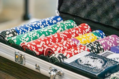 Image of an open briefcase filled with unique playing cards, arranged to sh.. Stock Photos